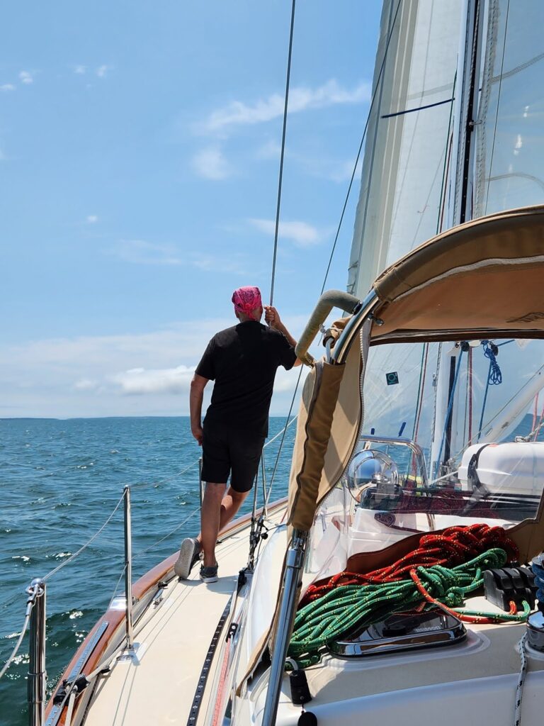 standing on deck while sailing
