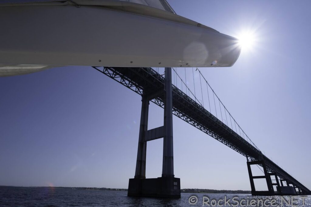 sailing under newport pell bridge